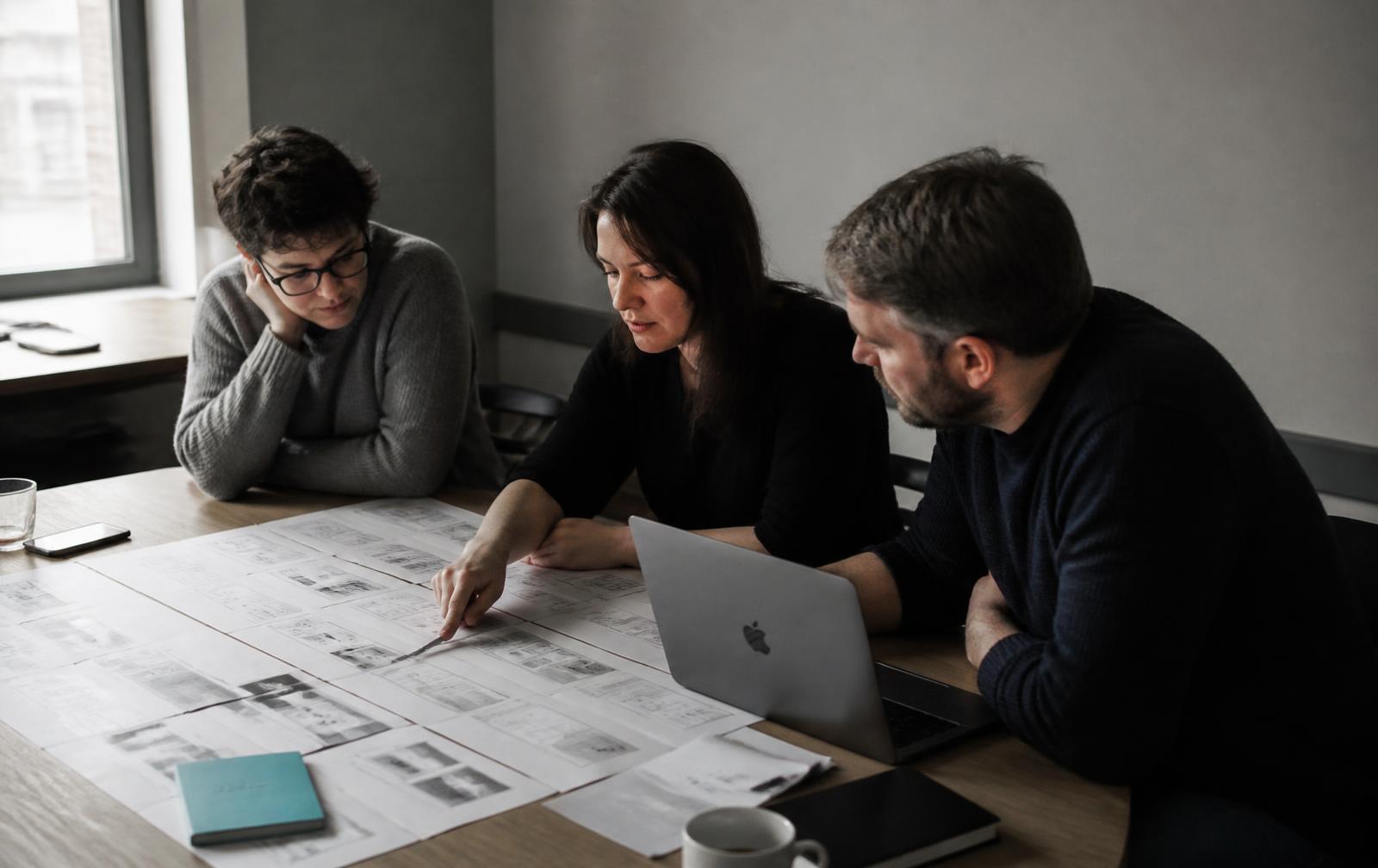 the Merging Minds team working together in the studio